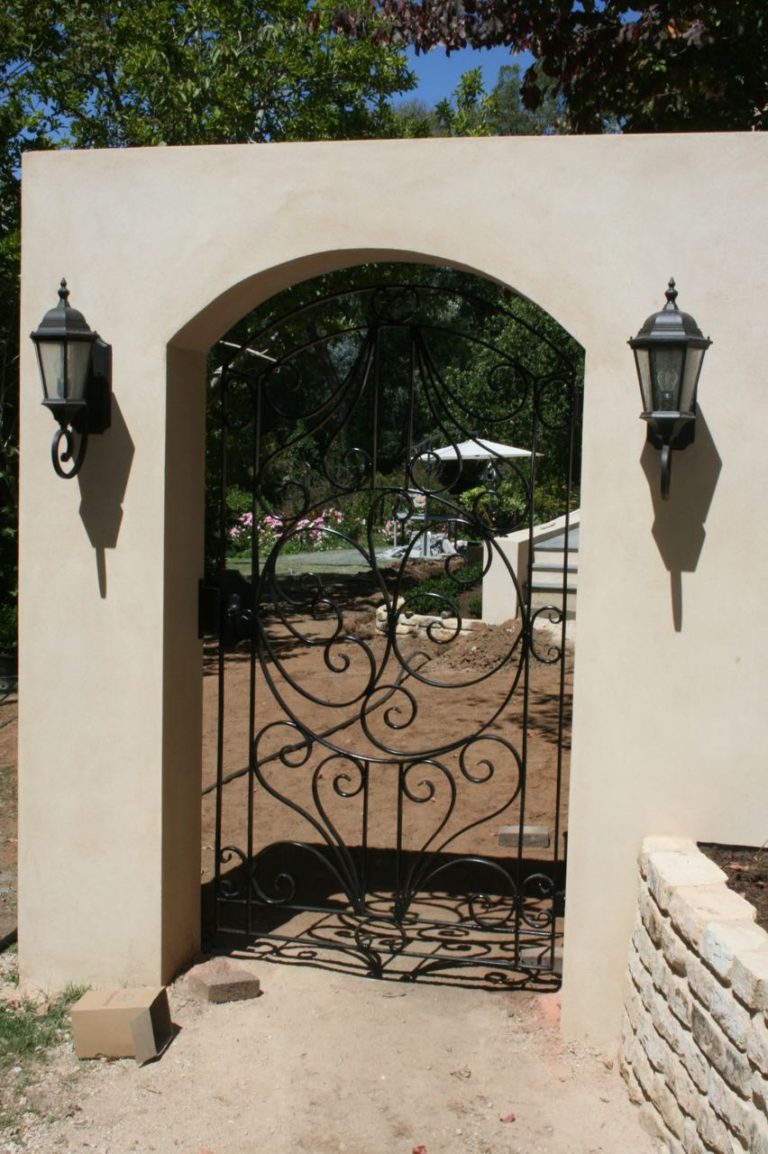 spanishstylewroughtirongatebuiltintoarchedfence GATE