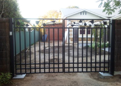 Inward opening double driveway gates, featuring modern leaf design panels