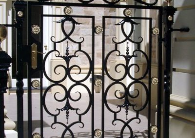 ornate-lockable-victorian-wrought-iron-gate-with-brass-rosettes-entrance-to-a-courtyard